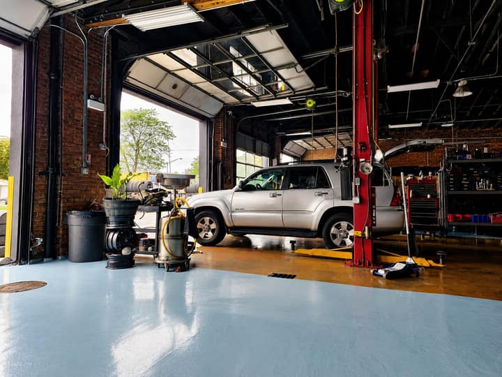 An open ERMAK Tires service bay with daylight coming in.